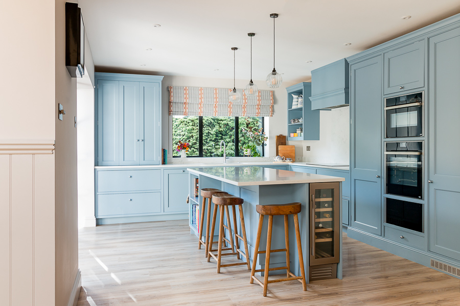 Photo of open plan kitchen with blue units