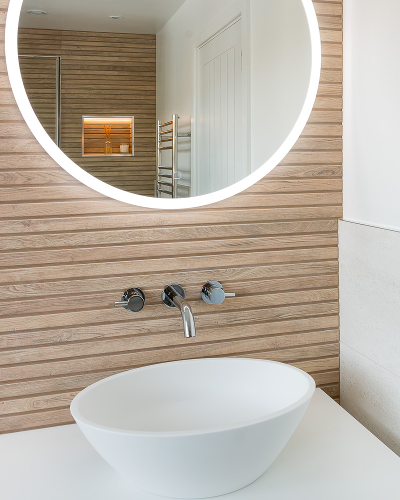 Interiors photography of a bathroom mirror and vanity unit